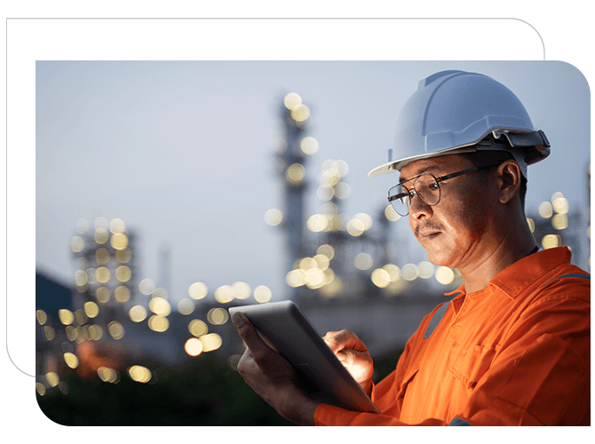 Engineer is collecting data of oil refinery through his iPad.