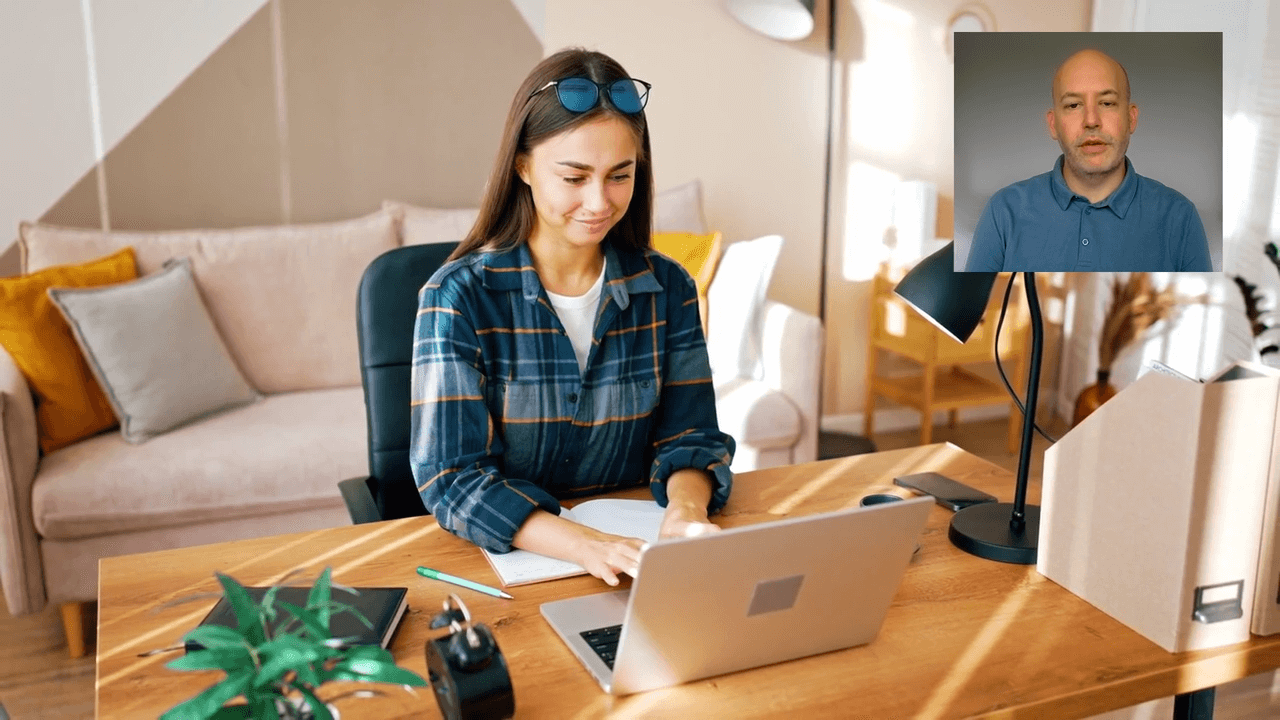 Women smiling and working on laptop